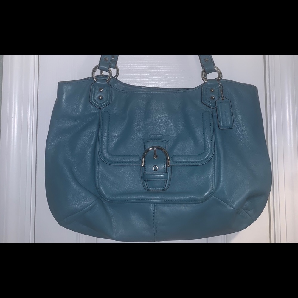 Coach Purse some normal wear inside from use. Still in great shape.